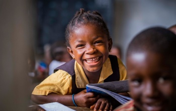 A Liberian child sitting in class gaining an education. 
