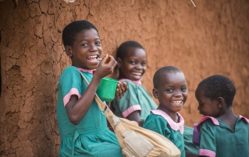 Children in Malawi eating Mary's Meals