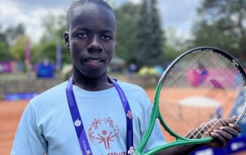 Patrick with his tennis racquet at the Special Olympics
