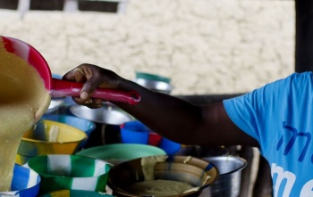 a volunteer serves food