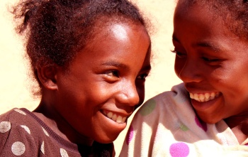 Two friends smiling at each other