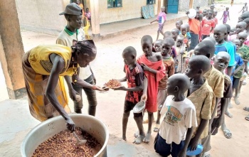 a volunteer serves food