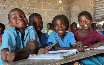 Efigênia in class with school friend