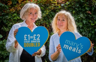 celebrity sisters Sophie and Emma Thomson posing for a campaign photo