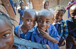 Boys joke and pose together in Zambia