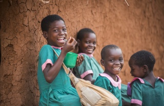 Children in Malawi eating Mary's Meals