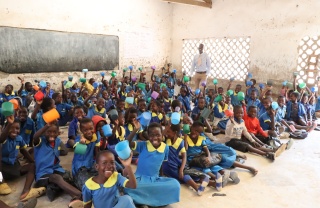 Alexander Lulanga and his classroom of children in Malawi. 