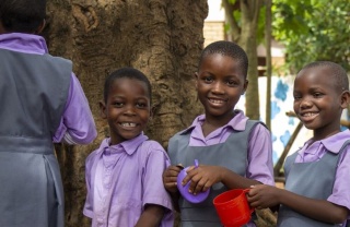 Children waiting to be served Mary's Meals at school in Malawi.