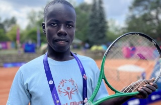 Patrick with his tennis racquet at the Special Olympics