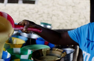 a volunteer serves food