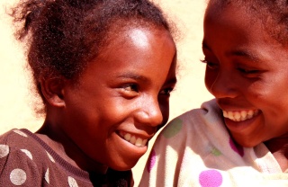 Two friends smiling at each other