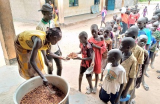 a volunteer serves food