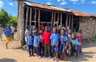 Children together outside their school in Mozampbique