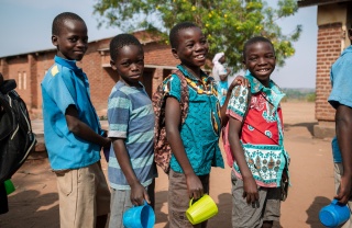 Children lined up to receive their meal