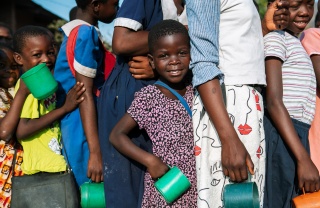 Children lined up to receive their meal