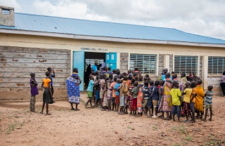Children lined up to receive their meal