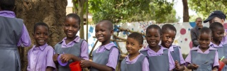 Children waiting to be served Mary's Meals at school in Malawi.