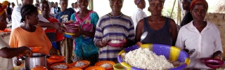 Volunteers serve food in Liberia