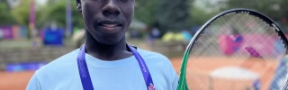 Patrick with his tennis racquet at the Special Olympics
