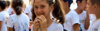 a girl eats outside her school