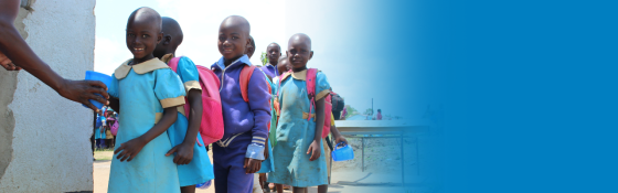 Children lined up to receive their meal