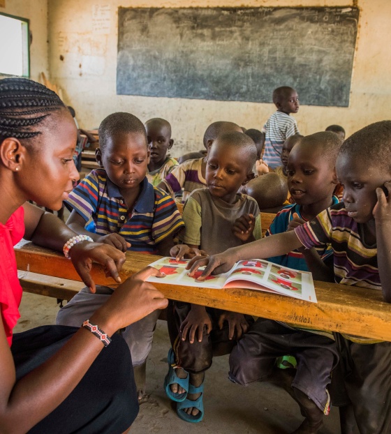 children in class listening attentively to their teacher 