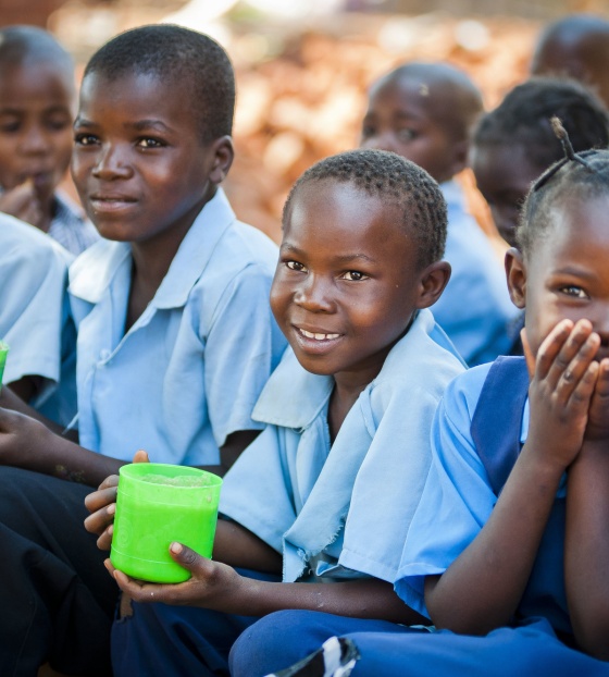 Children at school eating Mary's Meals.