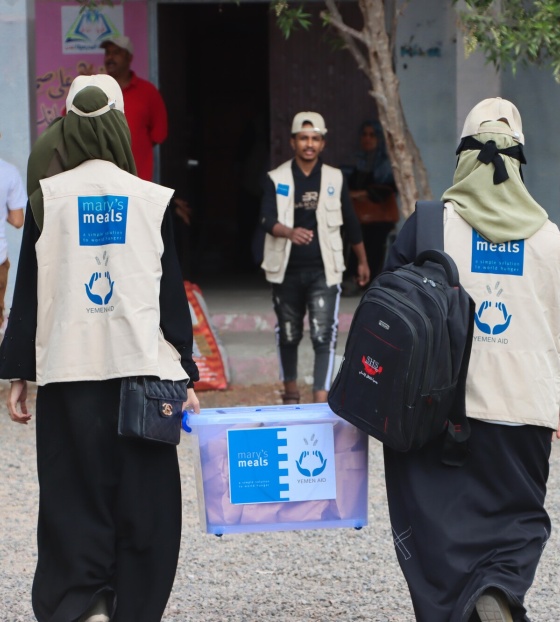 Yemen Aid staff working to serve school children with Mary's Meals.