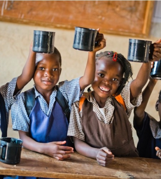 Children in Malawi eating Mary's Meals