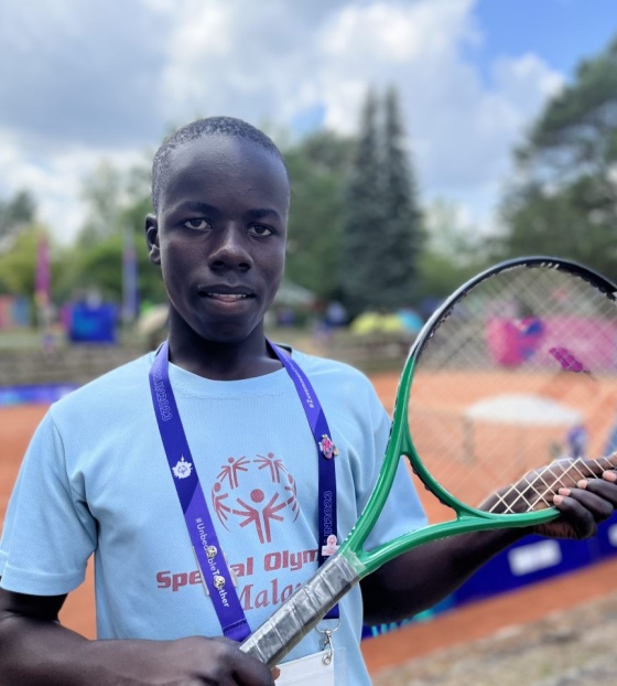 Patrick with his tennis racquet at the Special Olympics
