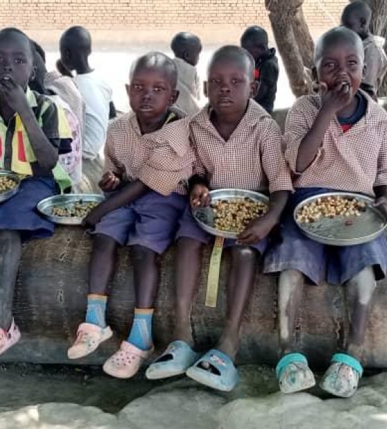 Children in South Sudan eating Mary's Meals