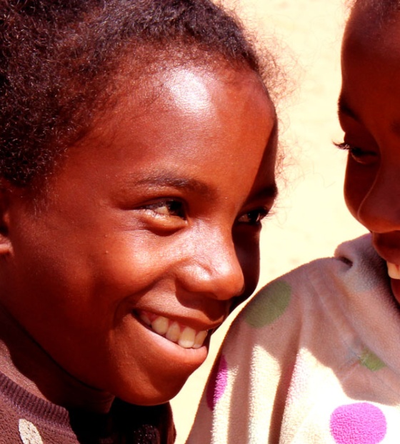 Two friends smiling at each other