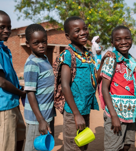 Children lined up to receive their meal