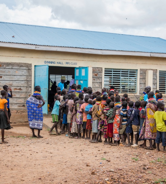 Children lined up to receive their meal