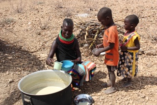 Children being served by a volunteer