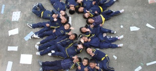a class of children in the playground together