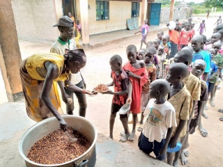 a volunteer serves food