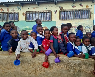 Children lined up to receive their meal